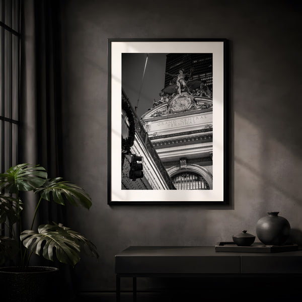 NYC Grand Central from the Right, Mercury Statue framed in black above a terracotta velvet sofa, gray plaster wall — Good Beans NYC.