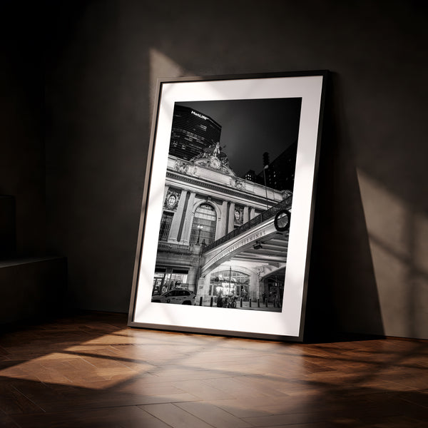 NYC Grand Central from the Left, 42nd Street framed in black above a terracotta velvet sofa, gray plaster wall — Good Beans NYC.
