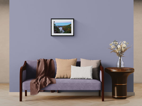 NY Mohonk Mountain House Fall, Hudson Valley framed in black above a beige sofa, sunlit yellow plaster wall — Good Beans NYC.