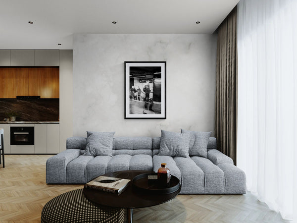 NYC Grand Central Motion, 4 5 6 Uptown framed in black above a beige sofa, sunlit yellow plaster wall — Good Beans NYC.