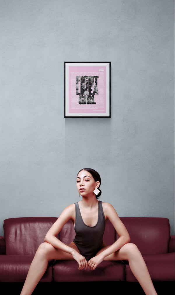 Fight Like a Girl Poster, Plaza de Mayo framed in black on a gallery wall with a side-profile viewer in a dark coat — Good Beans NYC.