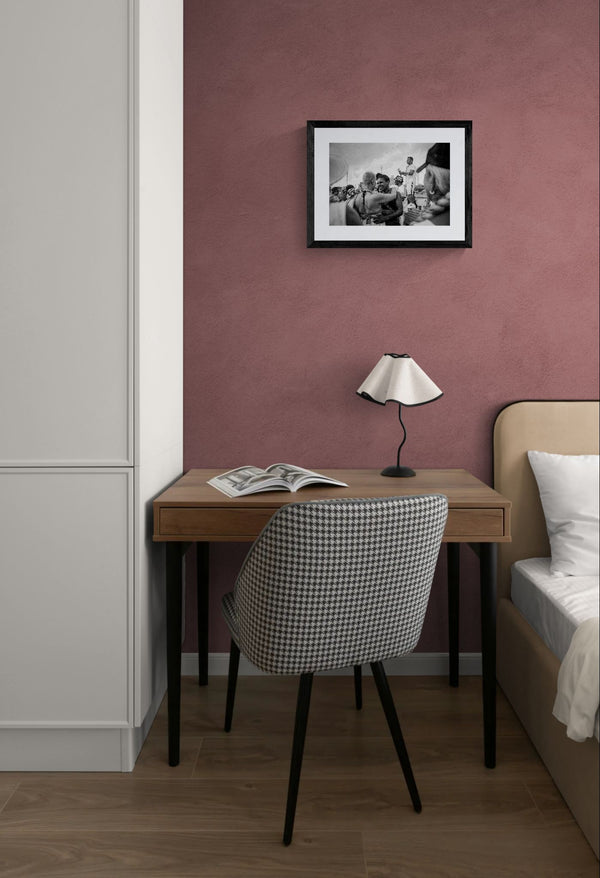 NYC Coney Island Girl Couple, Boardwalk framed in black above a beige sofa, sunlit yellow plaster wall — Good Beans NYC.