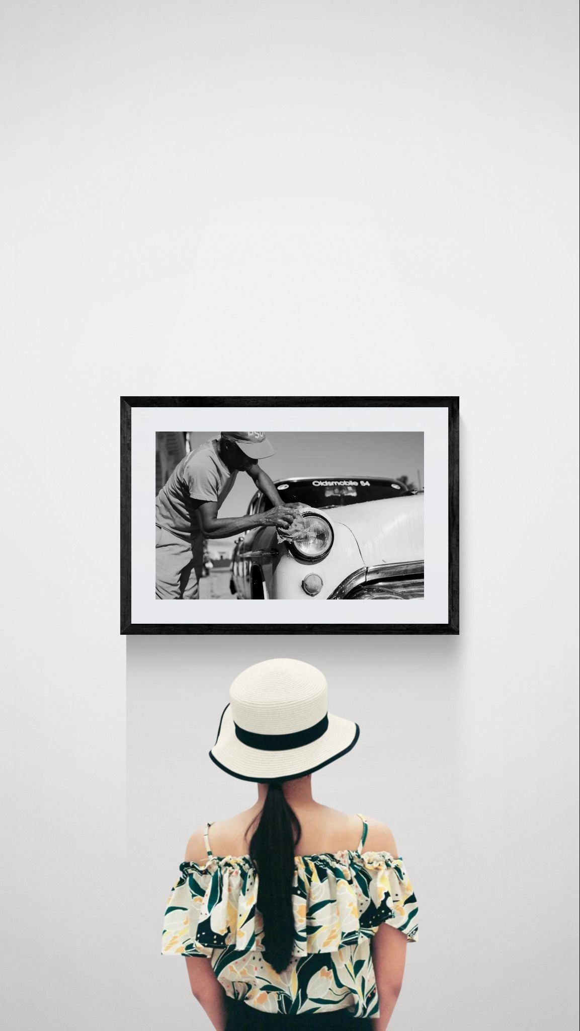 Cuba Car Wash, '54 Oldsmobile, Havana framed in black on a gallery wall with a viewer in a straw hat in front — Good Beans NYC.