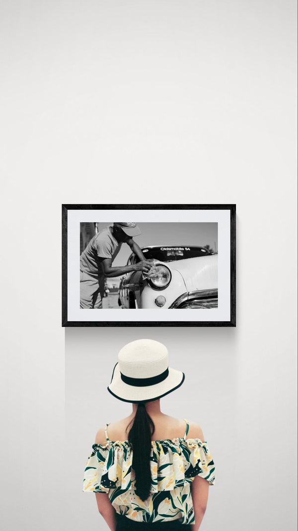 Cuba Car Wash, '54 Oldsmobile, Havana framed in black on a gallery wall with a viewer in a straw hat in front — Good Beans NYC.