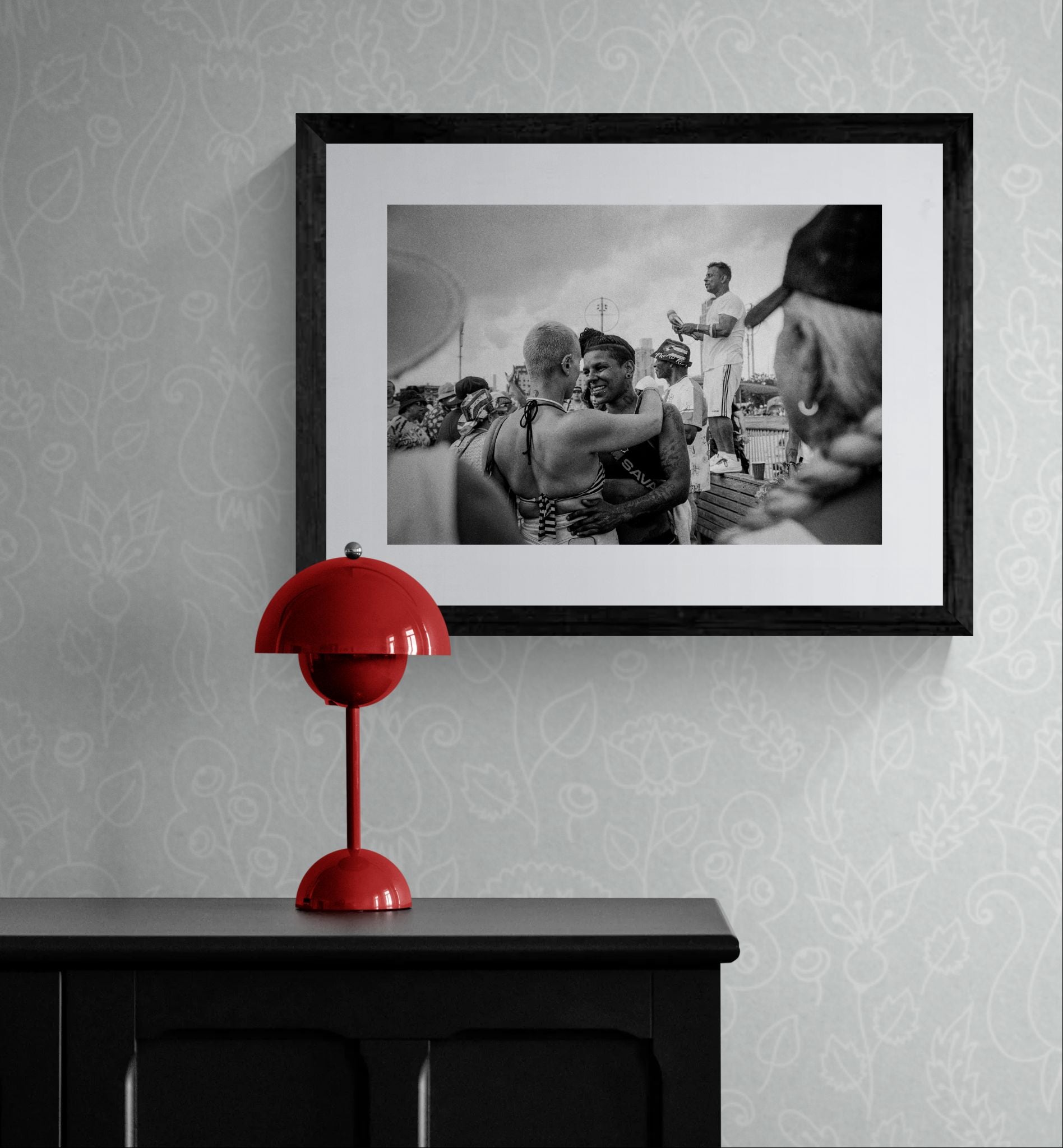 NYC Coney Island Girl Couple, Boardwalk framed in black above a terracotta velvet sofa, gray plaster wall — Good Beans NYC.