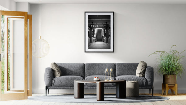 NYC Subway ACE Downtown & Brooklyn, Portals Series framed in black above a beige sofa, sunlit yellow plaster wall — Good Beans NYC.