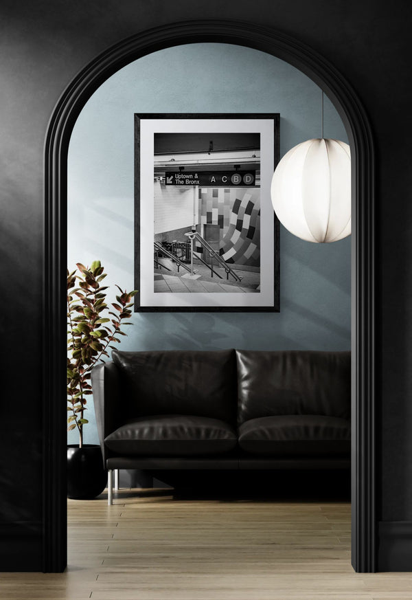 NYC Subway ACBD Uptown & Bronx, Portals Series framed in black above a terracotta velvet sofa, gray plaster wall — Good Beans NYC.