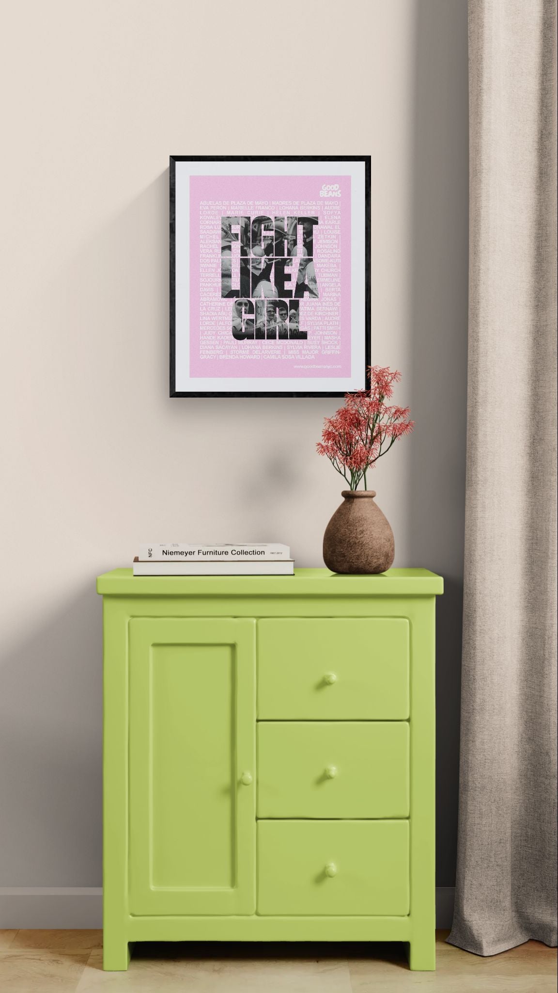 Fight Like a Girl Poster, Plaza de Mayo framed in black on a gallery wall with a viewer in a straw hat in front — Good Beans NYC.