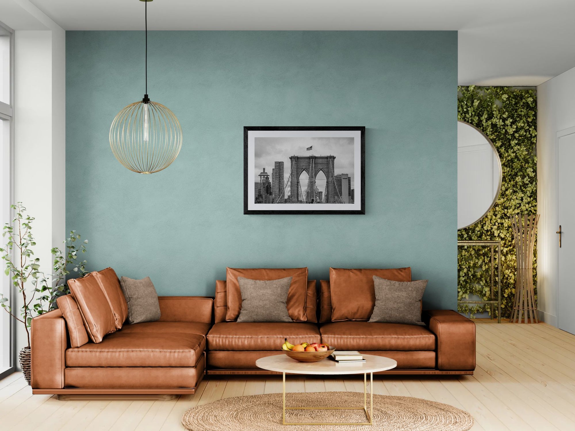 NYC Brooklyn Bridge from Afar, Manhattan Skyline framed in black above a terracotta velvet sofa, gray plaster wall — Good Beans NYC.