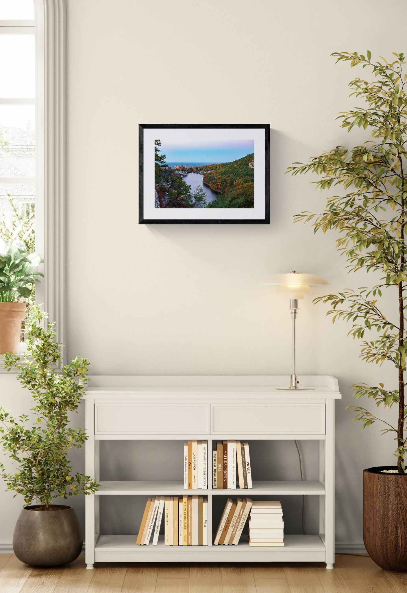 NY Mohonk Mountain House Fall, Hudson Valley framed in black above a brown leather sectional, teal wall, gold pendant lamp — Good Beans NYC.