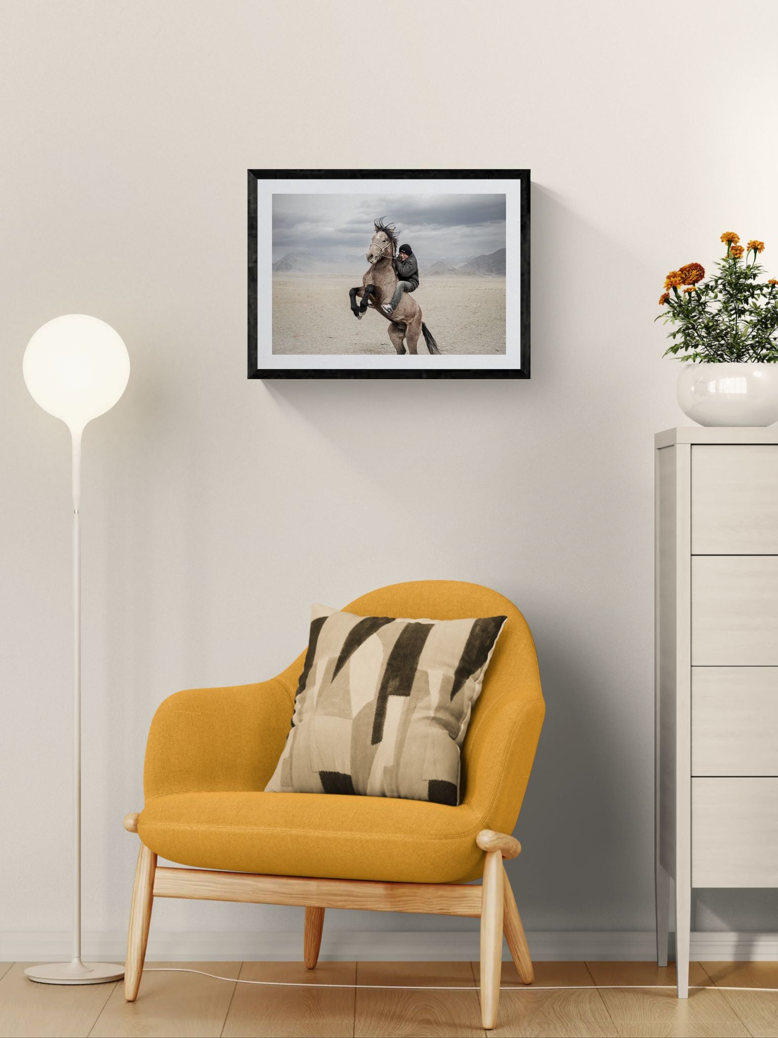 Mongolian Horse Rider, Bayan-Ölgii framed in black on a gallery wall with a viewer in a straw hat in front — Good Beans NYC.