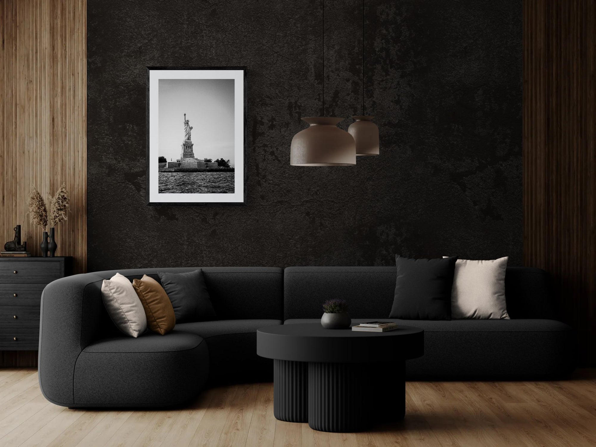 NYC Statue of Liberty from the Hudson framed in black above a beige sofa, sunlit yellow plaster wall — Good Beans NYC.
