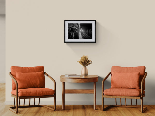 NYC Subway 5 Train Platform, Portals Series framed in black above a beige sofa, sunlit yellow plaster wall — Good Beans NYC.