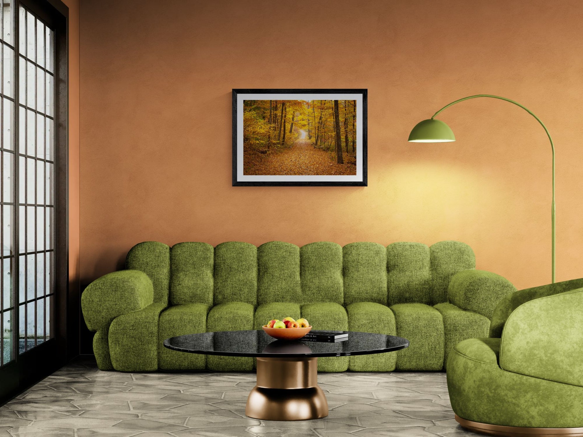NY Fall Forest, Hudson Valley — New Paltz framed in black above a terracotta velvet sofa, gray plaster wall — Good Beans NYC.