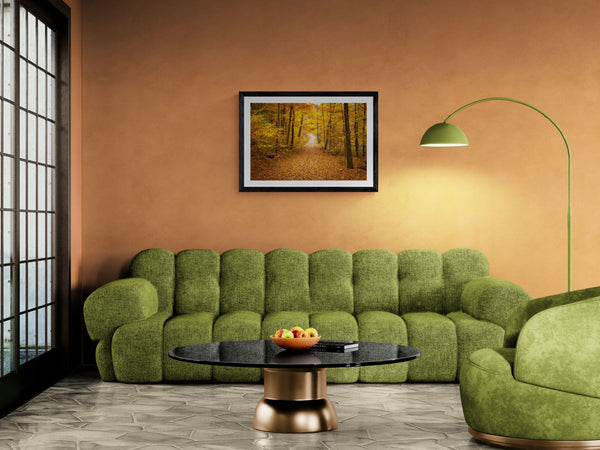 NY Fall Forest, Hudson Valley — New Paltz framed in black above a terracotta velvet sofa, gray plaster wall — Good Beans NYC.