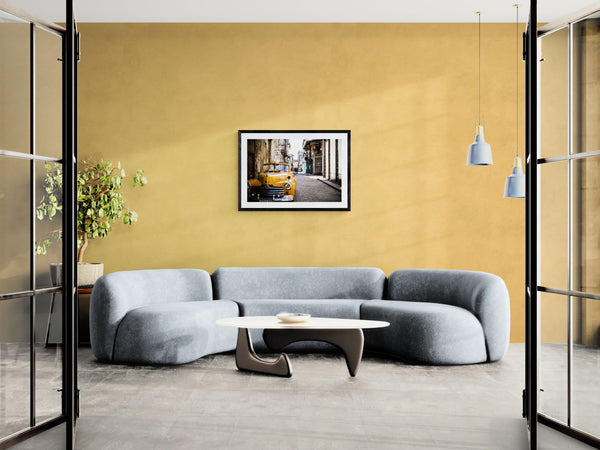 Cuba Taxi, Old Havana framed in black above a beige sofa, sunlit yellow plaster wall — Good Beans NYC.