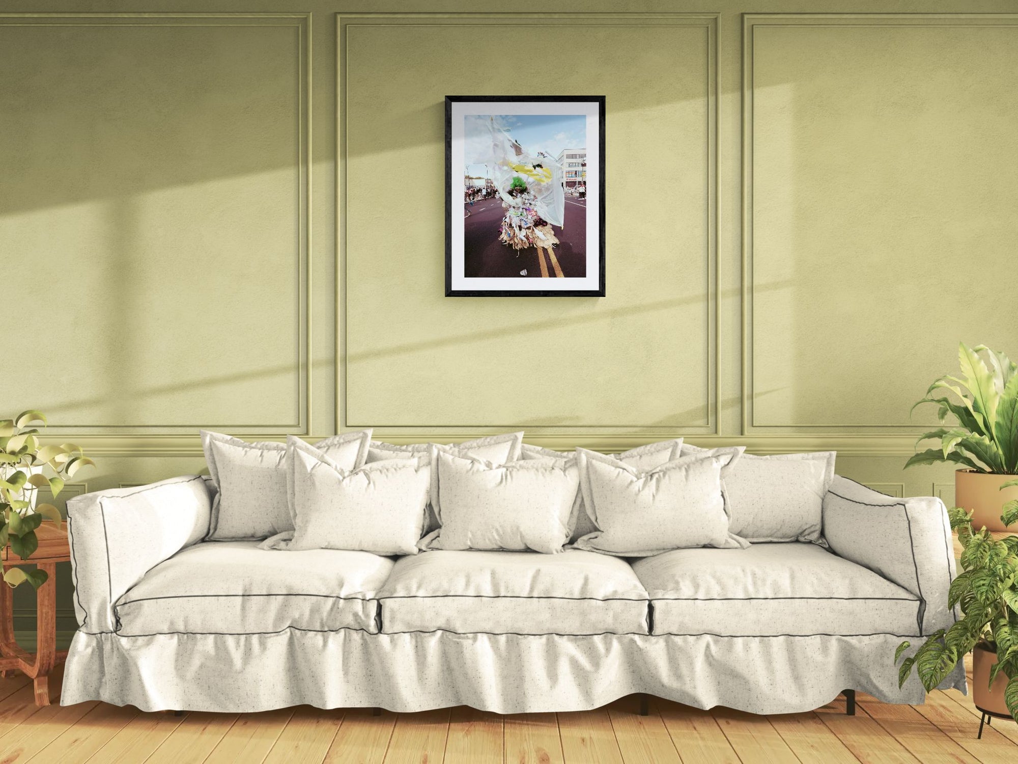 NYC J'Ouvert Green Woman Trash Costume, Flatbush framed in black above a terracotta velvet sofa, gray plaster wall — Good Beans NYC.