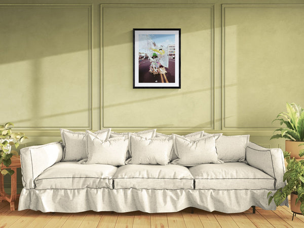 NYC J'Ouvert Green Woman Trash Costume, Flatbush framed in black above a terracotta velvet sofa, gray plaster wall — Good Beans NYC.