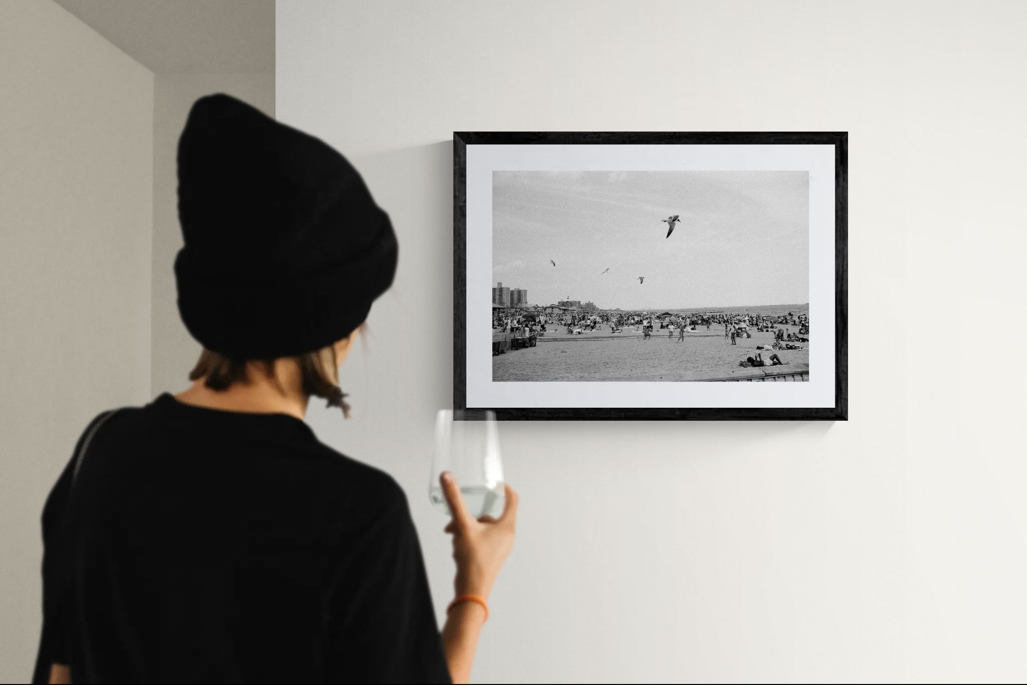 NYC Coney Island Beach Birds, Brooklyn framed in black above a terracotta velvet sofa, gray plaster wall — Good Beans NYC.