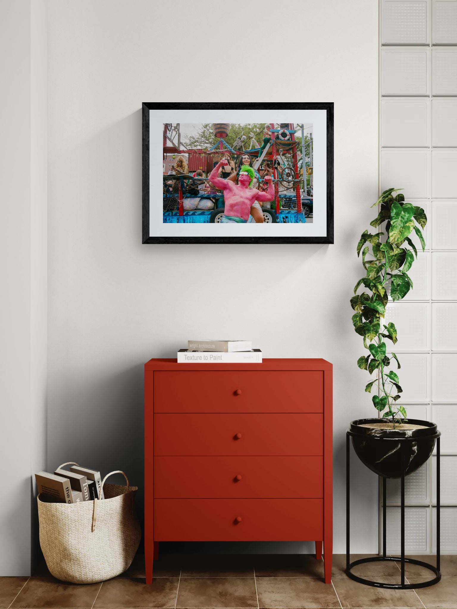 NYC Mermaid Parade Pink Hulk — Coney Island framed in black above a terracotta velvet sofa, gray plaster wall — Good Beans NYC.