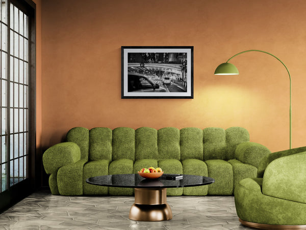NYC Grand Central Pershing Square, 42nd Street framed in black above a terracotta velvet sofa, gray plaster wall — Good Beans NYC.
