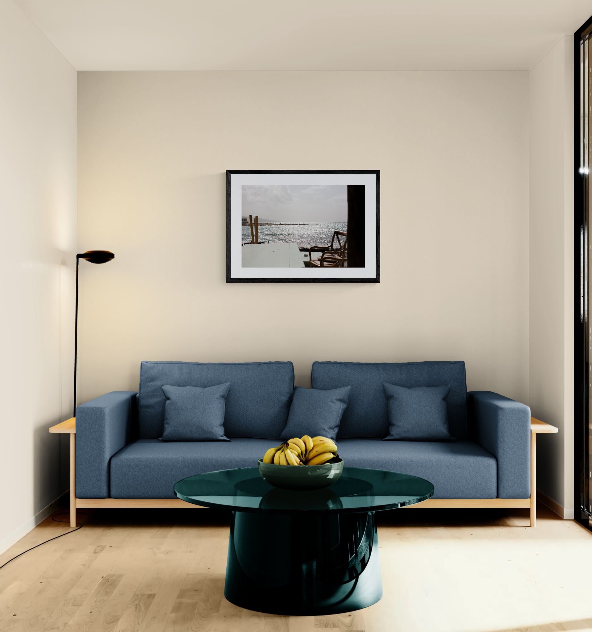Wing Foiling off the Coast of Byblos, Lebanon framed in black above a beige sofa, sunlit yellow plaster wall — Good Beans NYC.