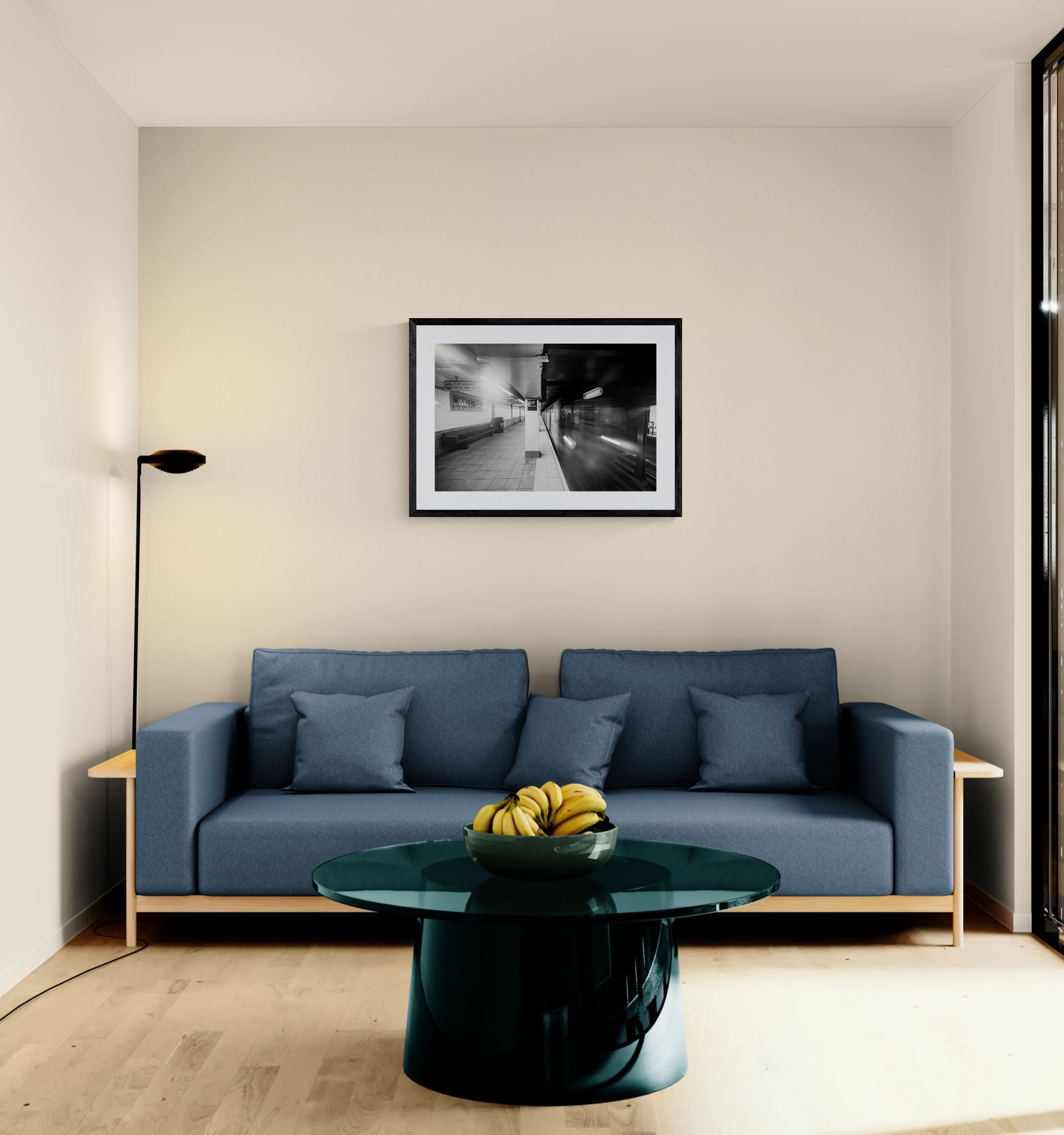 NYC Subway Wall Street Platform Blur framed in black above a terracotta velvet sofa, gray plaster wall — Good Beans NYC.