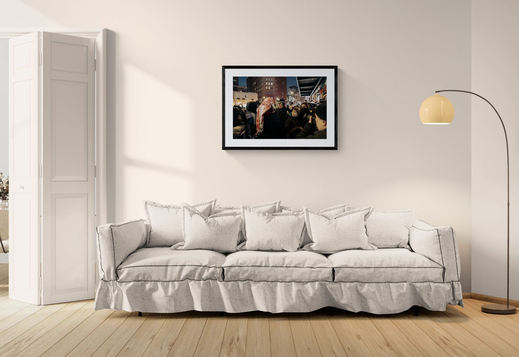 NYC NYPD Megaphone Standoff, Pro Palestine framed in black above a terracotta velvet sofa, gray plaster wall — Good Beans NYC.