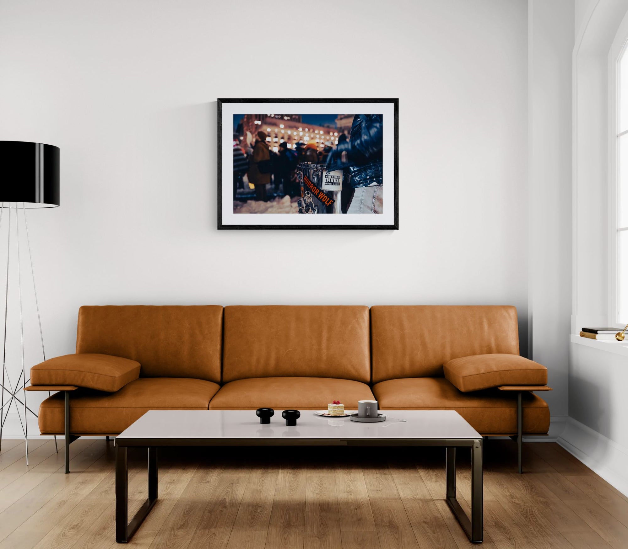NYC Activist Therapy Session Drum, Winter Protest framed in black above a terracotta velvet sofa, gray plaster wall — Good Beans NYC.