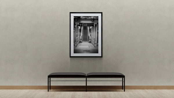 NYC Subway Union Square 4 5 6 Heading Up, Portals Series framed in black above a terracotta velvet sofa, gray plaster wall — Good Beans NYC.