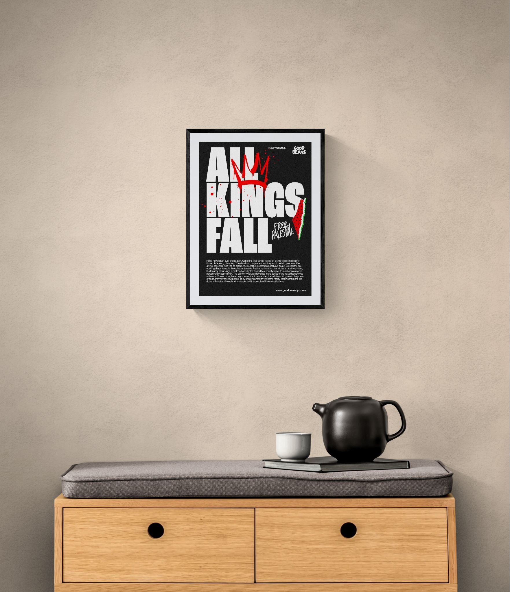 All Kings Fall Poster — Free Palestine framed in black above a terracotta velvet sofa, gray plaster wall — Good Beans NYC.