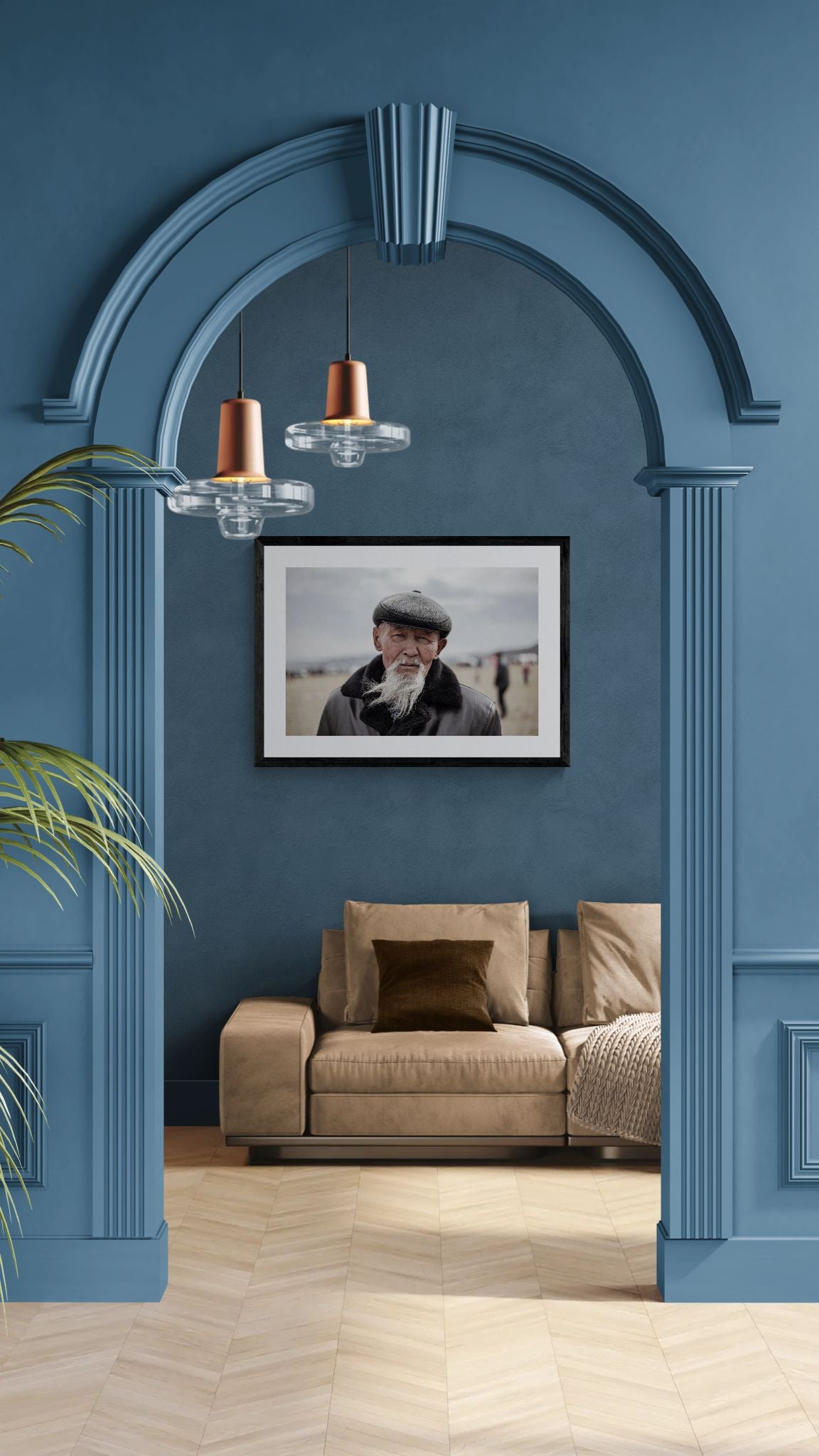 Old Mongolian Man Portrait, Bayan-Ölgii framed in black on a gallery wall with a viewer in a straw hat in front — Good Beans NYC.