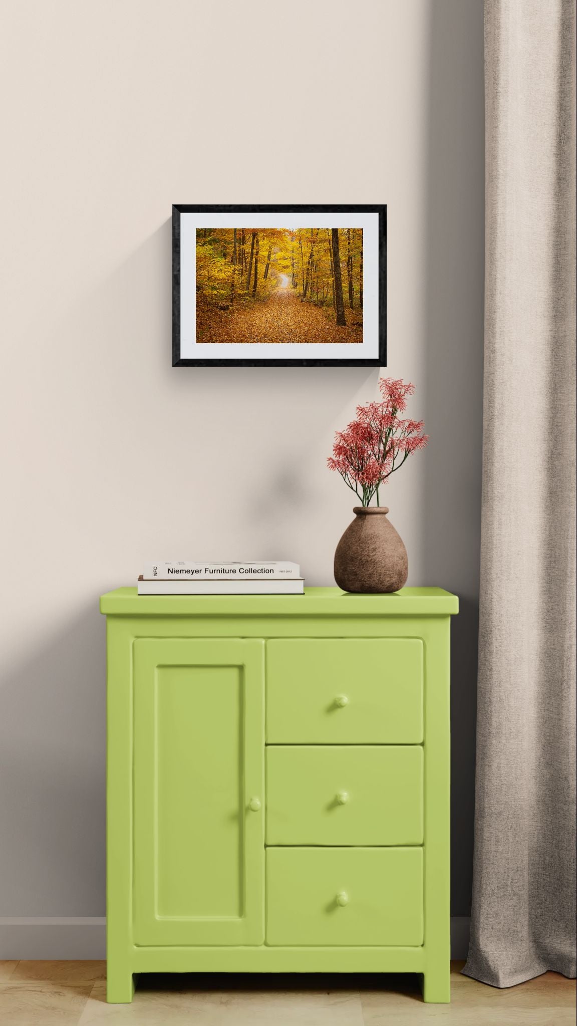 NY Fall Forest, Hudson Valley — New Paltz framed in black above a brown leather sectional, teal wall, gold pendant lamp — Good Beans NYC.