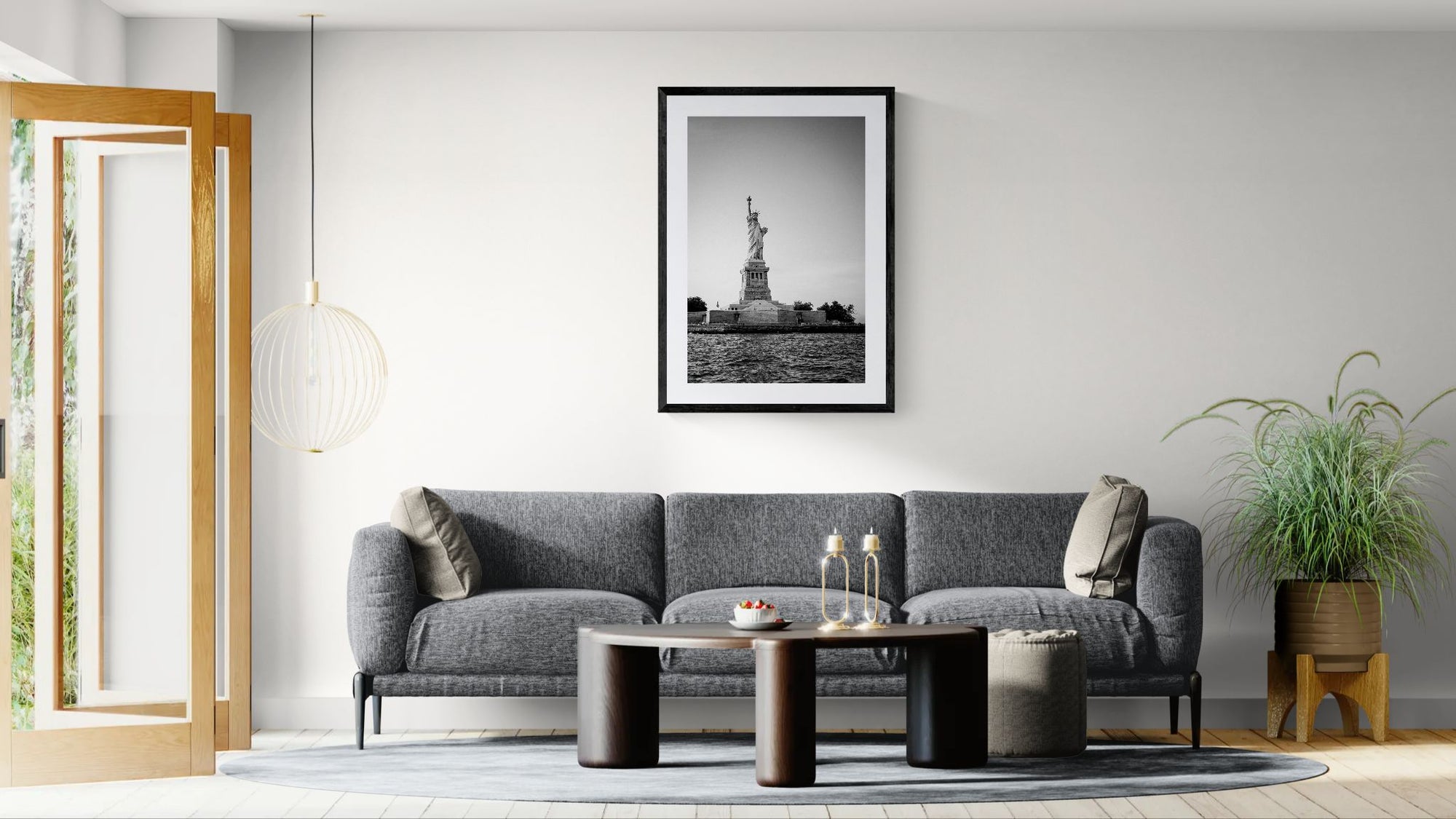 NYC Statue of Liberty from the Hudson framed in black on a gallery wall with a viewer in a straw hat in front — Good Beans NYC.