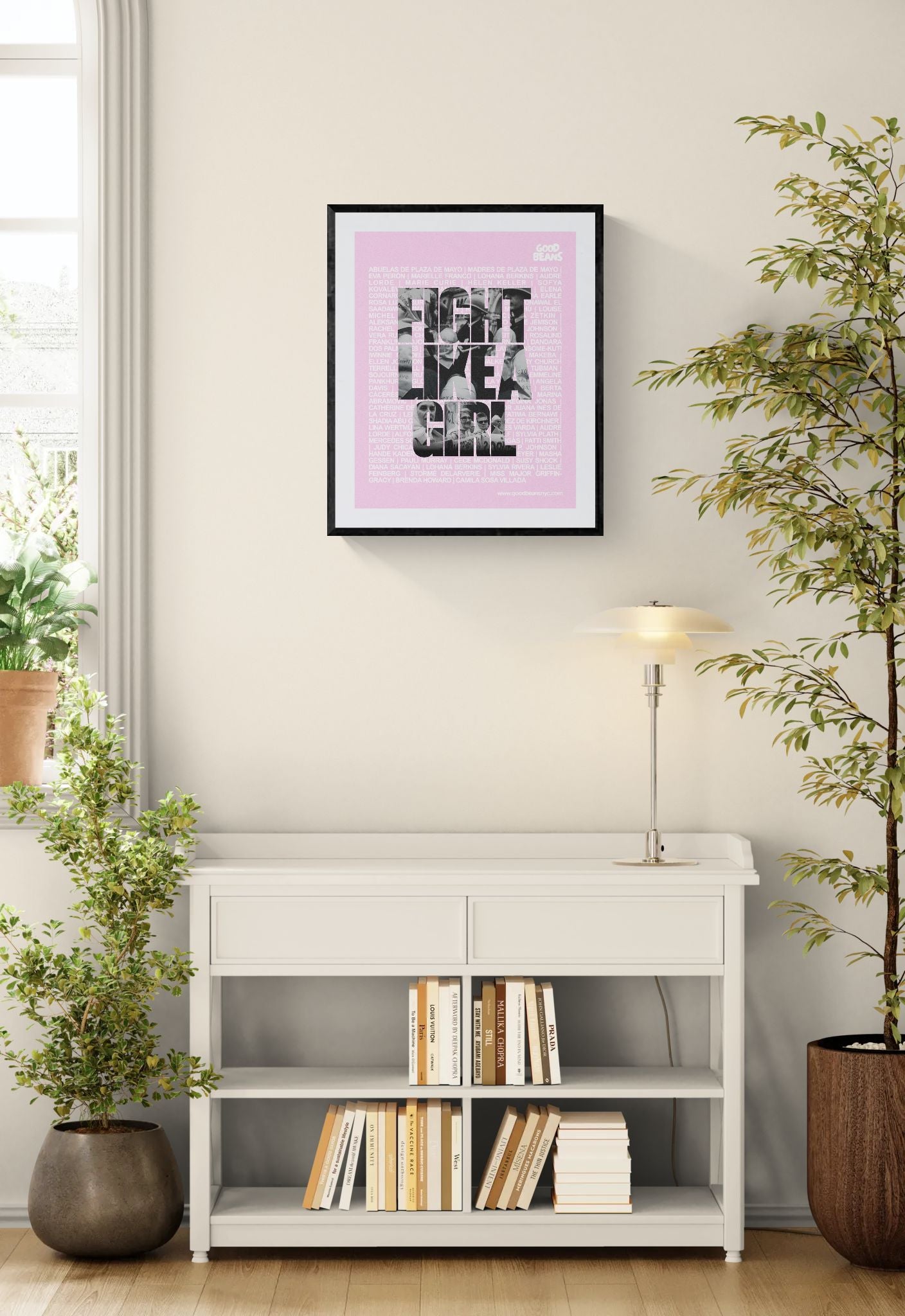 Fight Like a Girl Poster, Plaza de Mayo framed in black above a beige sofa, sunlit yellow plaster wall — Good Beans NYC.
