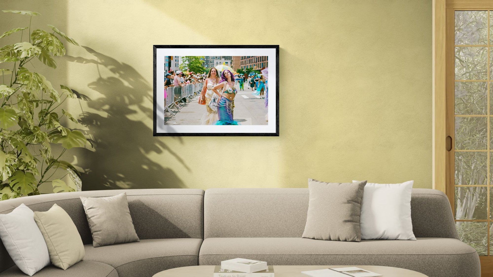 NYC Mermaid Parade Mermaids Posing, Surf Avenue framed in black on a gallery wall with a side-profile viewer in a dark coat — Good Beans NYC.