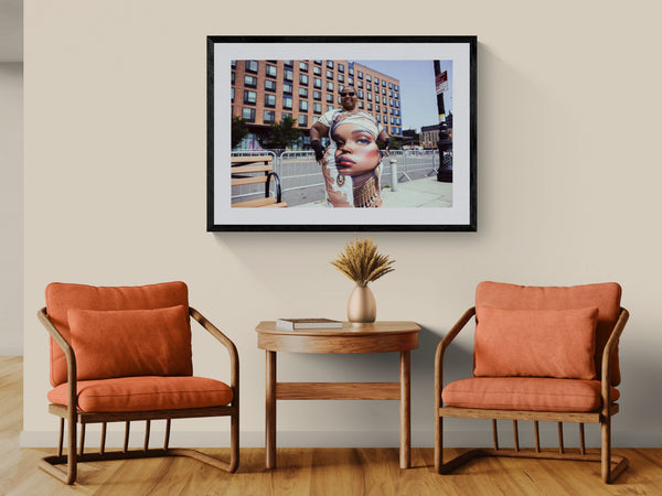 NYC Mermaid Parade Queen Dress, Coney Island framed in black above a beige sofa, sunlit yellow plaster wall — Good Beans NYC.