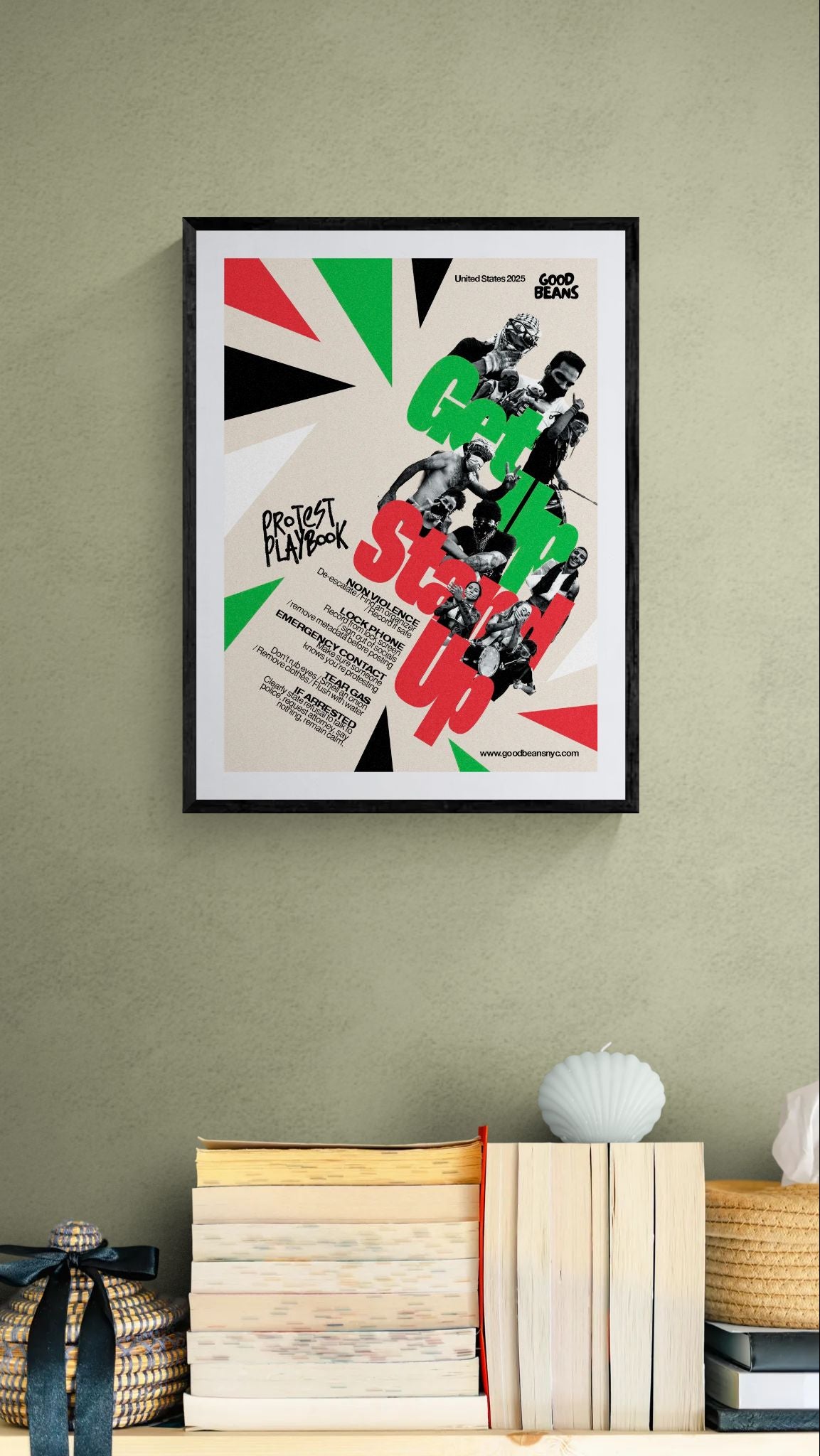 Get In Stand Up Protest Playbook Poster framed in black above a brown leather sectional, teal wall, gold pendant lamp — Good Beans NYC.