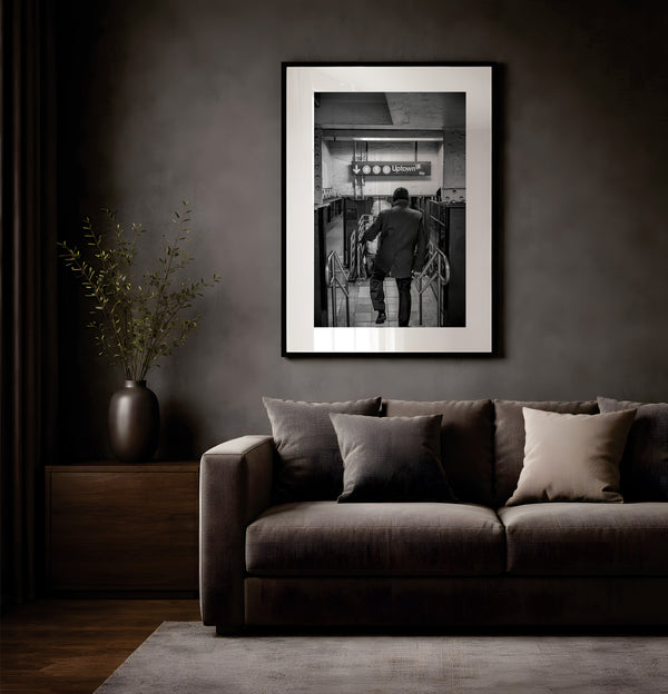 NYC Subway 456 Man Rushing, Portals Series framed in black above a terracotta velvet sofa, gray plaster wall — Good Beans NYC.