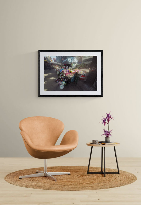 NYC Flower Cart Brooklyn — Under the J Train framed in black on a gallery wall with a side-profile viewer in a dark coat — Good Beans NYC.