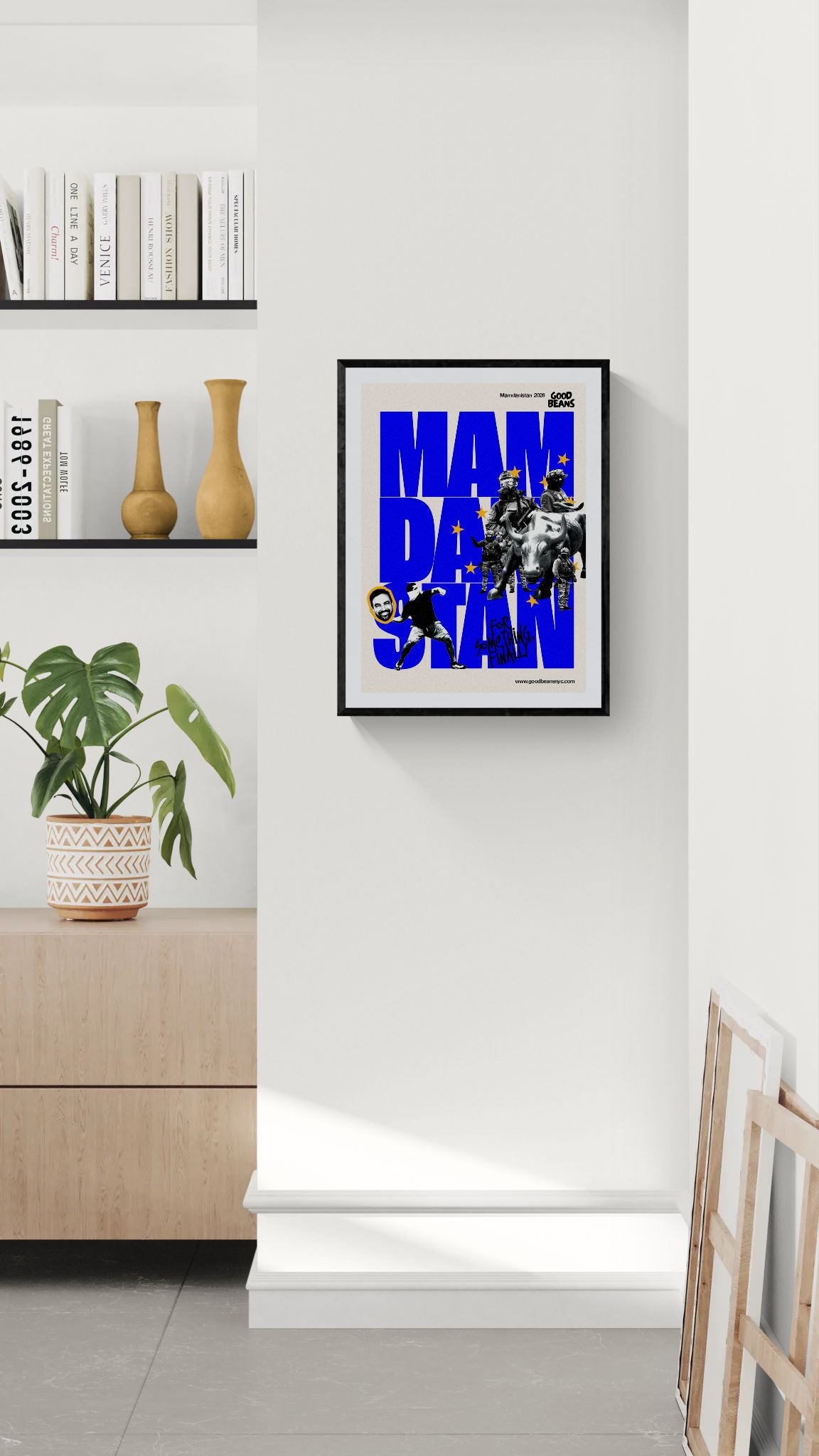 Mamdanistan Poster, Mayor Zohran Mamdani framed in black above a terracotta velvet sofa, gray plaster wall — Good Beans NYC.