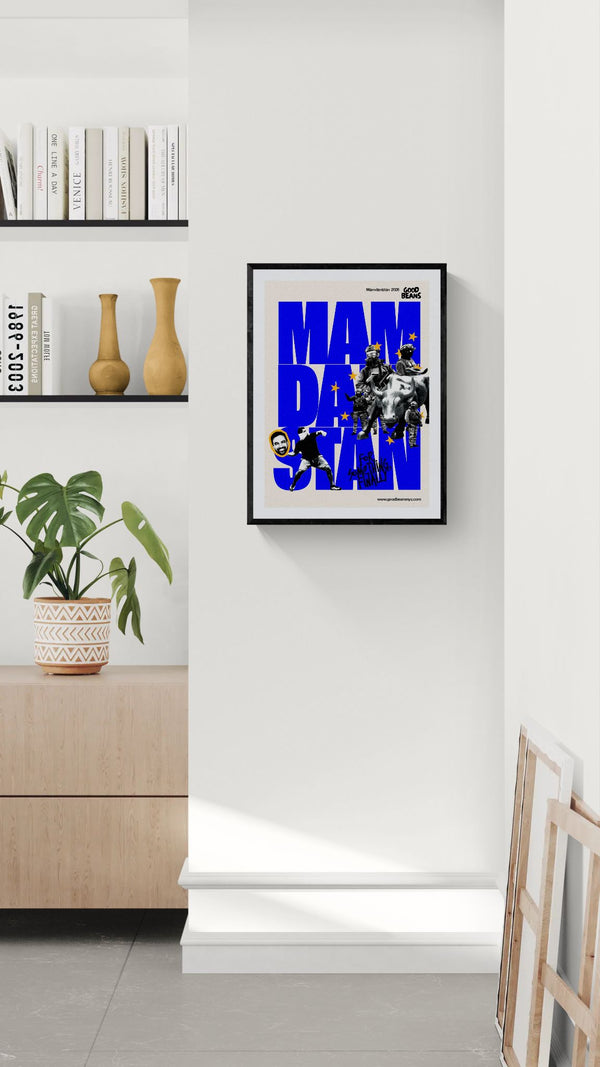 Mamdanistan Poster, Mayor Zohran Mamdani framed in black above a terracotta velvet sofa, gray plaster wall — Good Beans NYC.