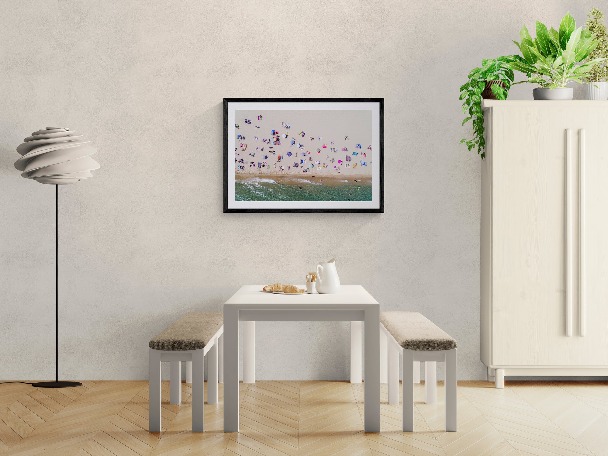 Barcelona from the Air, Barceloneta Beach by Karim Iliya framed in black on a gallery wall with a side-profile viewer in a dark coat — Good Beans NYC.
