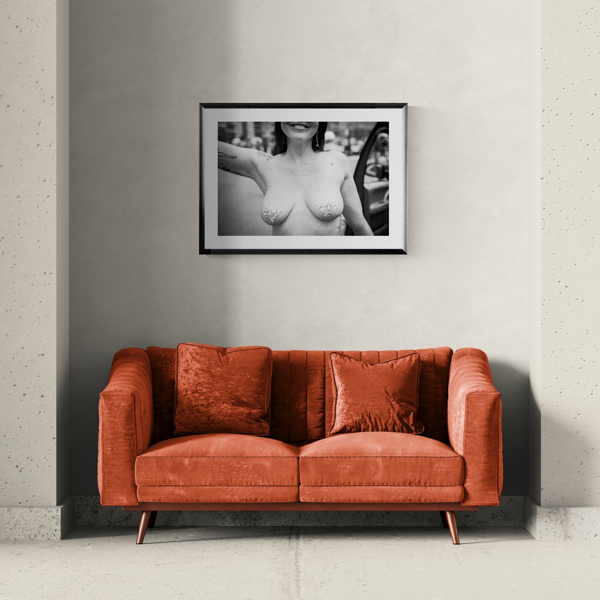 F*ck ICE Mermaid Protest Print — Coney Island framed in black above a brown leather sectional, teal wall, gold pendant lamp — Good Beans NYC.